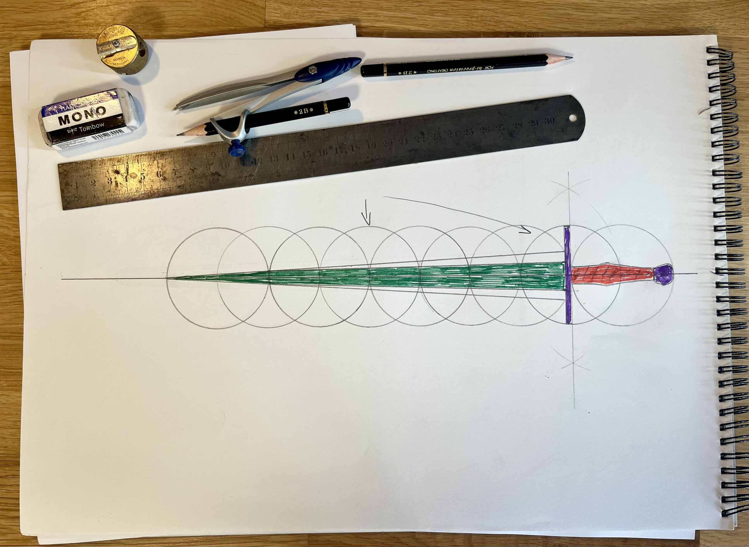 the sword coloured in, with a green blade, purple hilt furniture, and red handle, designed with Vadi Sword Geometry